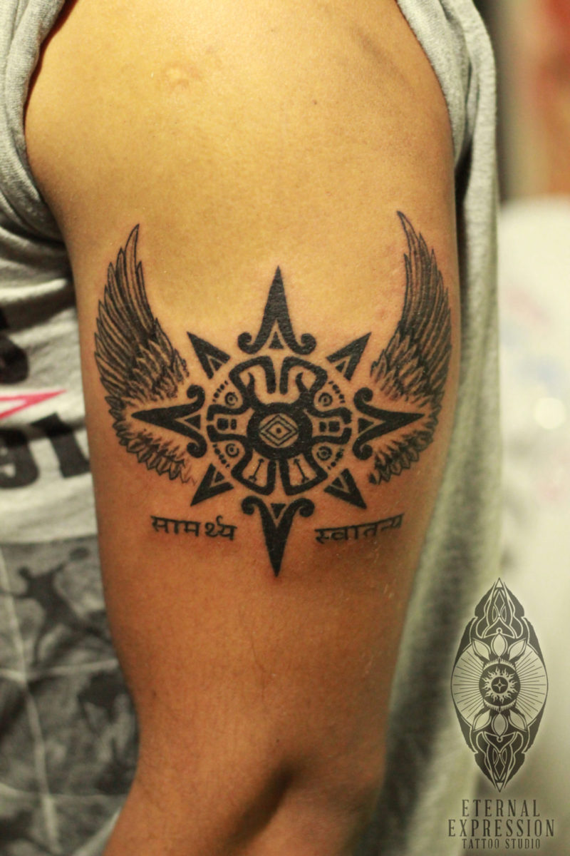 awesome aztec tattoo wings sun - boy gets Tattoo on the arm -Tattooed and designed by Tattoo Artist Veer Hegde (India`s Best Tattoo Artist in Bengaluru)