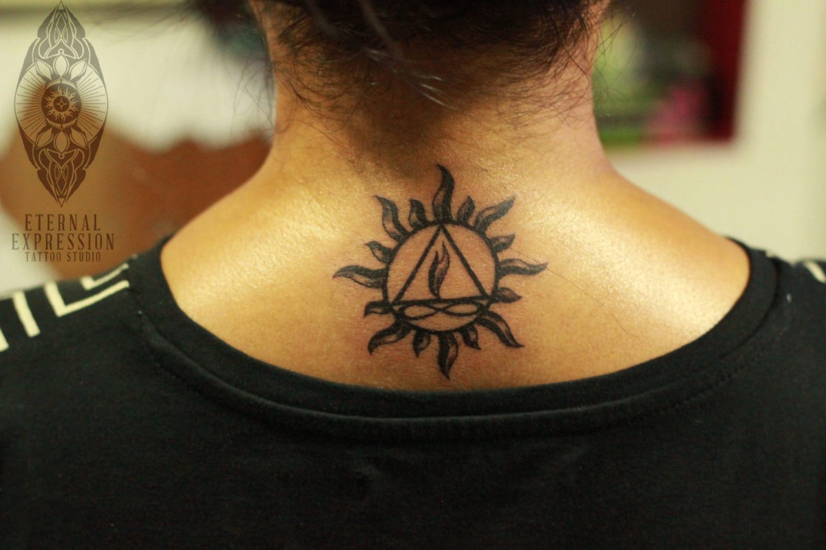 Sun and Twin flame tattoo - girl gets Tattoo on the nape/back -Tattooed and designed by Tattoo Artist Veer Hegde (India`s Best Tattoo Artist in Bengaluru)