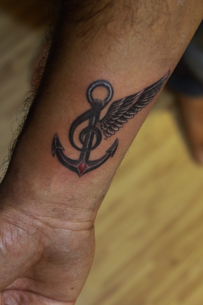 BEST ANCHOR WING MUSIC WRIST TATTOO FOR MEN BANGALORE VEER HEGDE BEST TATTOO ARTIST IN BANGALORE INDIA