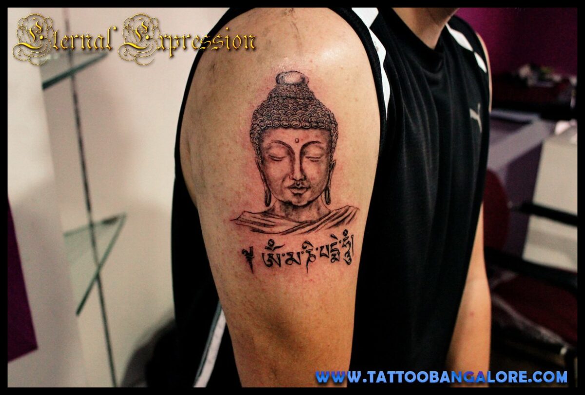 buddha tattoo with om mani padme hum mantra in Tibetan script - best arm tattoo for men eternal expression